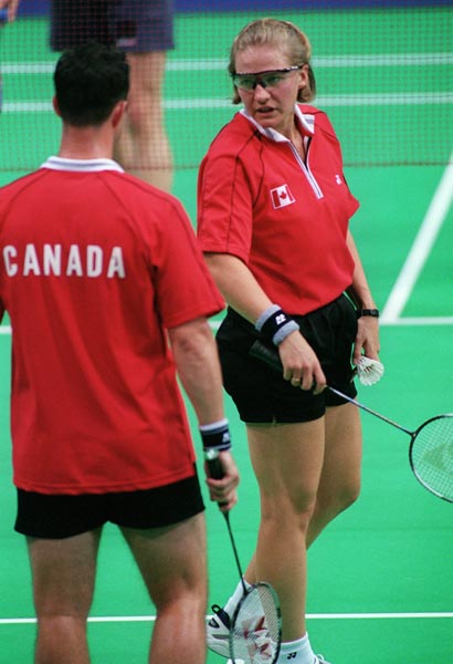 Canada's Milane Cloutier and Bryan Moody trading strategy during a game of mixed doubles badminton at the 2000 Sydney Olympic Games. (CP Photo/ COA)