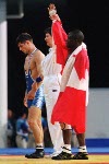 Canada's Daniel Igali celebrates his gold medal win in the wrestling event at the 2000  Sydney Olympic Games. (CP PHOTO/ COA)