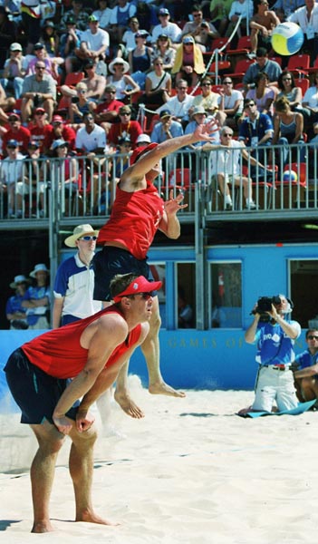 Canada's Mark Heese (bottom) and John Child (top)  in action during a beach volleyball tournament  at the Sydney 2000 Olympic Games. (CP PHOTO/ COA)