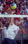 Guylaine Dumont of St-Antoine-de-Tilly, Que., goes for the ball against Simone Kuhn of Switzerland in Canada's victory at beach volleyball at the Athens Olympics, Saturday, August 14, 2004.  (CP PHOTO/COC-Mike Ridewood)