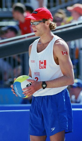 Canada's Conrad Leinemann competes in the beach volleyball event at the 2000 Sydney Olympic Games on September 22,2000. (CP Photo/ COA)