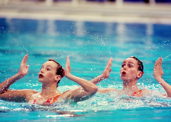Canada's Fanny Letourneau (L) and Claire Carver-Dias perform their synchronized swimming routine at the 2000 Sydney Olympic Games. (CP Photo/ COA)