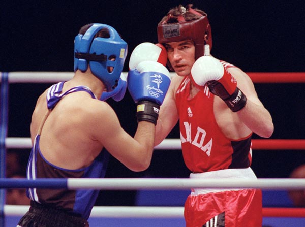 Canada's Mike Strange faces his opponent in the ring at the 2000 Sydney Olympic Games. (CP Photo/ COA)