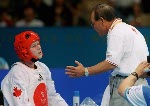 Canada's Dominique Bosshart of Winnipeg competed with Daniela Castrignano of Italy in the women's +67kg taekwondo category at the Olympic Games in Athens on Sunday Aug. 29, 2004. Bosshart lost 7-5 to Myriam Baverel, France, in first round, then was eliminated when she was beaten 7-3 by Castrignano in a second-chance repechage. (CP PHOTO/COC-Mike Ridewood)