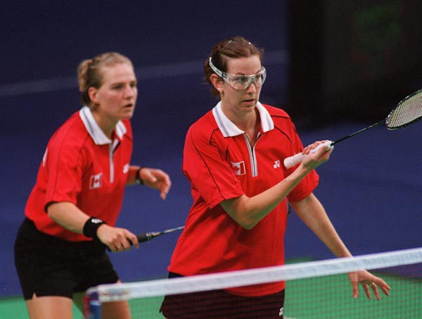Canada's Milaine Cloutier (L) and Robbyn Hermitage playing a set of women's doubles at the 2000 Sydney Olympic Games. (Mike Ridewood/CP Photo/ COA)