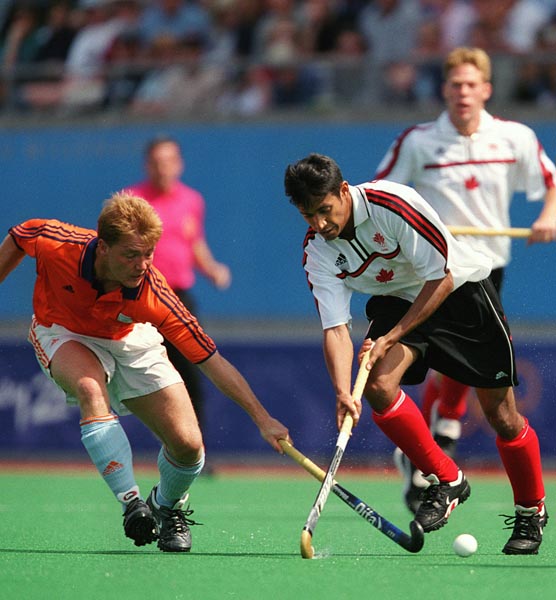 Canada's Ken Pereira playing field hockey at the 2000 Sydney Olympic Games. (CP Photo/ COA)
