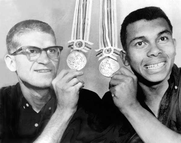 Canada's Bill Crothers (silver in the 800m) and Harry Jerome (bronze in the 100m) show off their medals at the 1964 Tokyo Olympics. (CP Photo/COA)