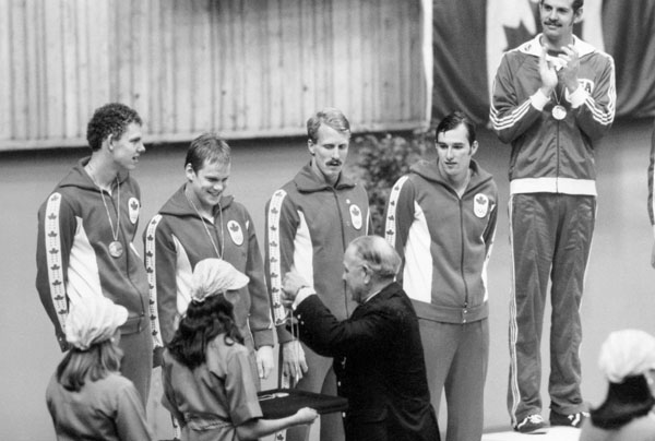Canada's 4x100m medley relay swim team, Gary MacDonald, Clay Evans, Stephen Pickell and Graham Smith, celebrates its silver medal at the 1976 Montreal Olympic Games. (CP Photo/COA/BB)
