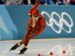 Canadian long-track Speed Skater Eric Brisson speeds past the Olypic rings during the 500 m in Salt Lake City, Utah Tuesday Feb. 12, at the 2002 Winter Olympic Games. (CP Photo/COA/Andre Forget)