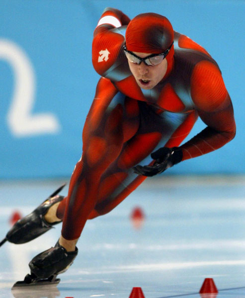 Canadian long-track speed skater Eric Brisson of Ste-Foy, Que. races during his 500-metre heat in Salt Lake City, Utah Tuesday Feb. 12, at the 2002 Winter Olympic Games. (CP Photo/COA/Andre Forget)