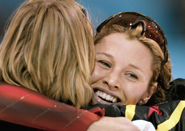 Catriona Lemay Doan (right) of Saskatoon celebrates her gold medal run with bronze medalist Sabine Voelker of Germany in the women's 500 metre speed skating event at the Winter Olympics in Salt Lake City, Thurs., Feb. 14, 2002.  (CP PHOTO/COA-Mike Ridewoo
