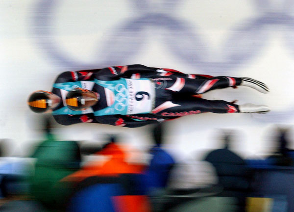 Canadian Doubles Luge team Chris Moffat and Eric Pothier race down the track at the Utah Olympic Park in Park City, Utah Friday Feb. 15, at the 2002 Winter Olympic Games.  (CP Photo/COA/ Andre Forget)