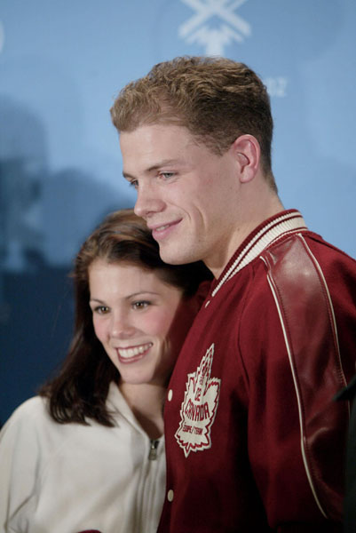 Canadian pairs skaters David Pelletier (right) and Jamie Sale at a press conference after the announcement that the pair would be given a gold medal at the Winter Olympics in Salt Lake City, Fri., Feb. 15, 2002.  (CP PHOTO/COA/Mike Ridewood)