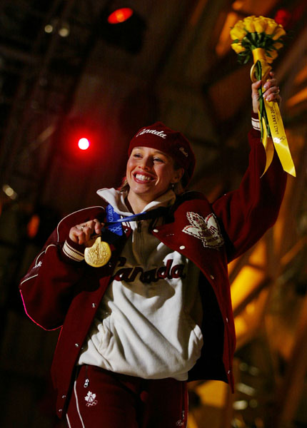Canadian Gold Medallist in the Women's 500 Meter Long Track speed skating event, Catriona Le May Doan saluteds the crowd after receiveing her gold medal in Salt Lake City, Utah Friday Feb. 15, at the 2002 Winter Olympic Games.  (CP Photo/COA/Andre Forget)