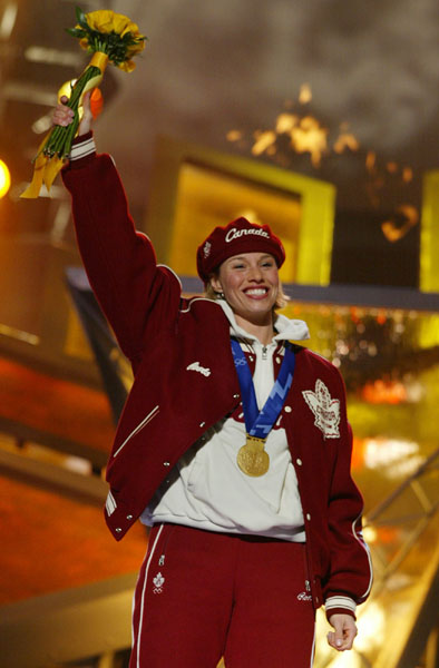 Canadian Gold Medallist in the Women's 500 Meter Long Track speed skating event, Catriona Le May Doan saluteds the crowd after receiveing her gold medal in Salt Lake City, Utah Friday Feb. 15, at the 2002 Winter Olympic Games. (CP Photo/COA/Andre Forget)