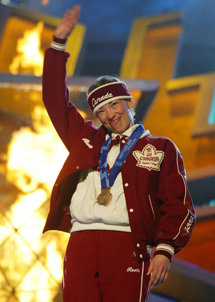 Canadian Beckie Scott salutes the crowd after receiveing her bronze medal for Cross Country 2 x 5 km pursuit in Salt Lake City, Utah Friday Feb. 15, at the 2002 Winter Olympic Games.   (CP Photo/COA/Andre Forget)
