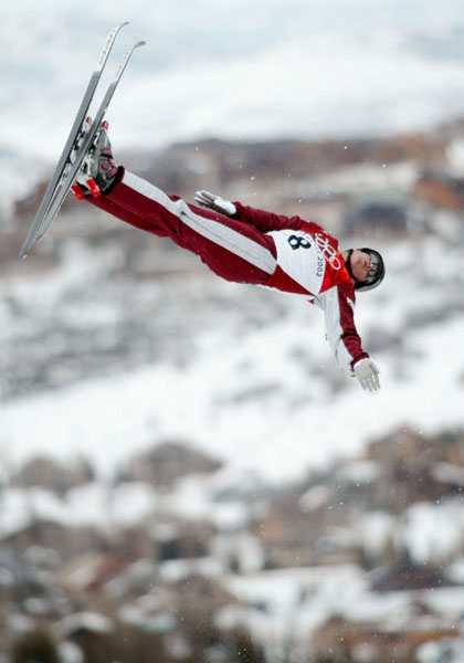 Steve Omischl of North Bay twists over Deer Valley, Utah, to qualify as the top Canadian at fourth for Tuesday's aerials final at the Winter Olympics, Saturday Feb. 16, 2002.  (CP PHOTO/COA/Mike Ridewood)