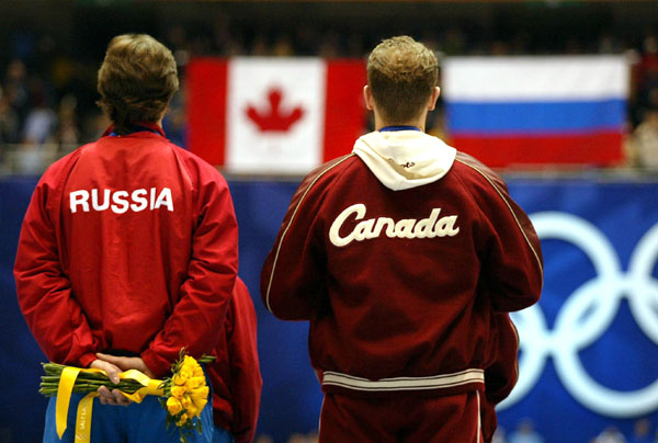 Gold medalists David Pelletier and Jamie Sale stand next to Russians Anton Sikharulidze and Elena Berezhnaya after being presented thier gold medals Sunday Feb. 17, at the 2002 Winter Olympic Games.  (CP Photo/COA/Andre Forget)