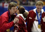 Co-Gold medalists Jamie Sale and Elena Berezhnaya share a hug as Anton Sikharulidze and David Pelletier look on after being presented thier gold medals Sunday Feb. 17, at the 2002 Winter Olympic Games.  (CP Photo/COA/Andre Forget)