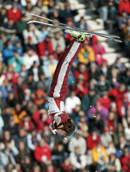 Veronica Brenner of Sharon, Ont., twists over the crowd on her first jump on her way to a silver medal in women's aerials at Deer Valley, Utah during the Winter Olympics, Mon., Feb. 18, 2002.  (CP PHOTO/HO/COA/Mike Ridewood)