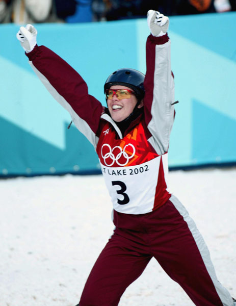 Deidra Dionne of Red Deer, Alta. celebrates after landing her second jump and taking the bronze medal in women's aerials at Deer Valley, Utah during the Winter Olympics, Mon., Feb. 18, 2002.  (CP PHOTO/COA/Mike Ridewood)
