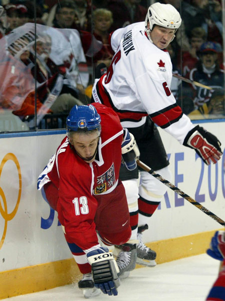 Team Canada Captain Mario Lemieux, of Montreal, throws Czech Pavel Kubina to the ice during the first period of the final round of Game 26 Monday Feb. 18, at the 2002 Winter Olympic Games in Salt Lake City.  (CP PHOTO/COA/Andre Forget)