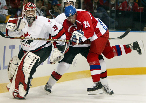 Team Canada goalie Martin Brodeur pushes Czech Milan Hejduk away from him during the first period of the Final Round of game 26 Monday Feb. 18, at the 2002 Winter Olympic Games in Salt Lake City. The final score was 3-3. (CP PHOTO/COA/Andre Forget)