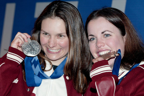 Aerials silver medalist Veronica Brenner (left) of Sharon, Ont., and bronze medalist Deidre Dionne of Red Deer pose for photographers with their medalsc in Salt Lake City, Utah during the Winter Olympics, Mon., Feb. 18, 2002.  (CP PHOTO/COA/Mike Ridewood)