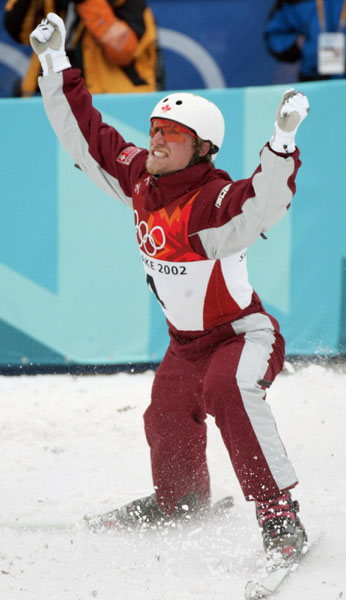 Jeff Bean of Ottawa celebrates landing his second jump to finish fourth in the men's aerials final at Deer Valley, Utah during the Winter Olympics, Tues., Feb. 19, 2002.  Bean was the top Canadian.  (CP PHOTO/COA/Mike Ridewood)