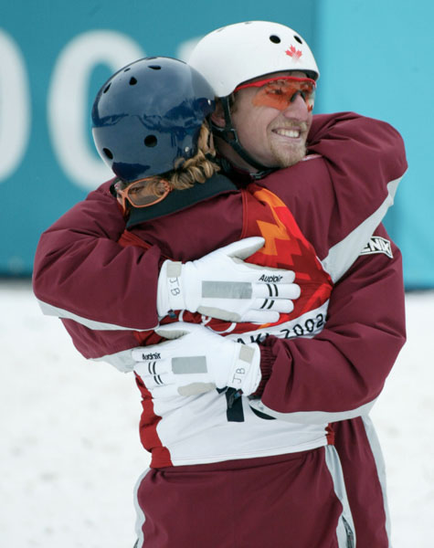 Jeff Bean (right) of Ottawa gets a hug from teammate Andy Capicik of Vancouver after finishing fourth in the men's aerials final at Deer Valley, Utah during the Winter Olympics, Tues., Feb. 19, 2002.   Capicik finished eighth. Bean was the top Canadian.