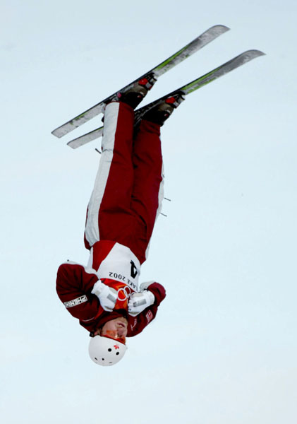Jeff Bean of Ottawa takes to the air and finished fourth in the men's aerials final at Deer Valley, Utah during the Winter Olympics, Tues., Feb. 19, 2002.  Bean was the top Canadian.  (CP PHOTO/COA/Mike Ridewood)