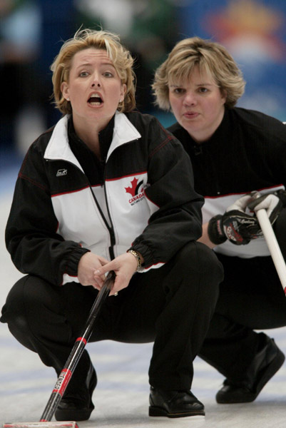 Canada's skip Kelley Law (left) and second Georgina Wheatcroft ponder a shot during Canada's 9-5  win over the U.S.A. in the bronze medal game at the Winter Olympics in Ogden, Utah duringThursday, Feb. 21, 2002  (CP PHOTO/COA/Mike Ridewood)