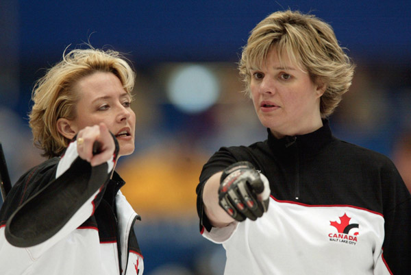 Canada's skip Kelley Law (left) and second Georgina Wheatcroft talk strategy during Canada's 9-5  win over the U.S.A. in the bronze medal game at the Winter Olympics in Ogden, Utah duringThursday, Feb. 21, 2002  (CP PHOTO/COA/Mike Ridewood)