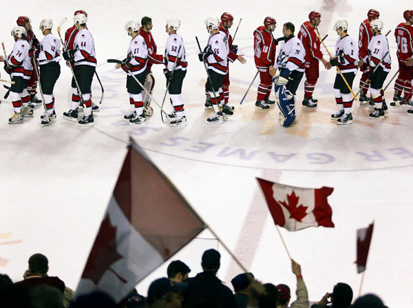 Team Canada and Team Belarus shake hands following  Olympic hockey action Friday Feb. 22, 2002 at the 2002 Winter Olympic Games in Salt Lake City.  Team Canada went on to win 7-1. (CP PHOTO/COA/Andre Forget)