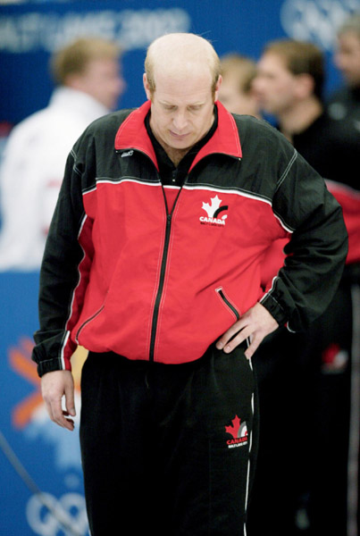 A dejected Canadian men's curling skip Kevin Martin walks off the ice after losing 6 - 5 in the gold medal game against Norway during the Winter Olympics at Ogden, Utah, Friday, Feb. 22, 2002 . (CP PHOTO/COA/Mike Ridewood)