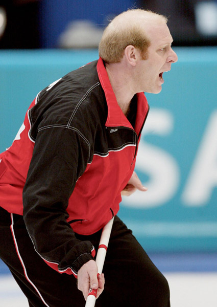 Canadian men's curling skip Kevin Martin (centre) yells as his final shot went long to take a  6 - 5 loss in the gold medal game against Norway during the Winter Olympics at Ogden, Utah, Friday Feb. 22, 2002 . (CP PHOTO/COA/Mike Ridewood)