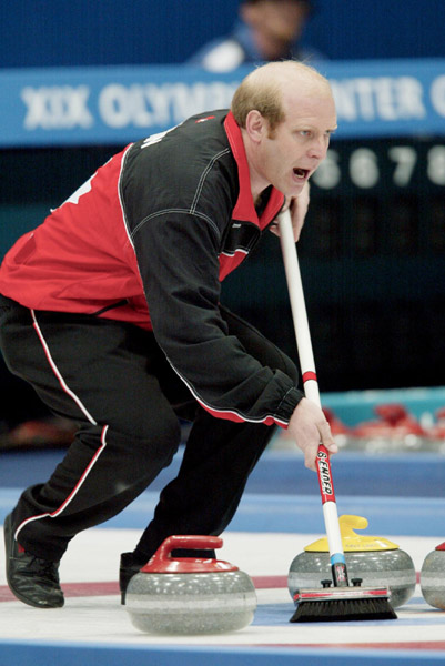Canadian men's curling skip Kevin Martin yells to his sweepers during a 6 - 5 Norway victory in the gold medal game during the Winter Olympics at Ogden, Utah, Friday, Feb. 22, 2002 . (CP PHOTO/COA/Mike Ridewood)