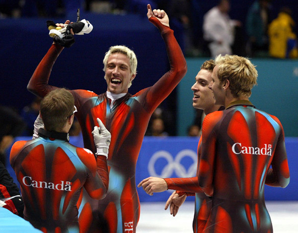 Canadian Short Track Gold medallists  (left to right) Mathieu Turcotte, Marc Gagnon, Francois-Louis Tremblay and Jonathan Guilmette celebrate after winning gold in the men's 5,000 metre relay Saturday Feb. 23, 2002 at the 2002 Winter Olympic Games in Salt