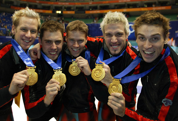Canadian Short Track Gold medallists  (L-R) Jonathan Guilmette, Eric Bedard, Mathieu Turcotte, Marc Gagnon, Francois-Louis Tremblay  celebrate after winning gold in the Men's 5000 metre Relay Saturday Feb. 23, 2002 at the 2002 Winter Olympic Games in Salt