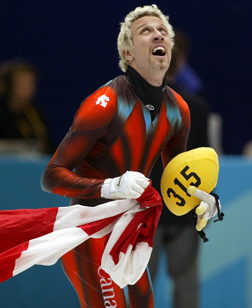Canadian Short Track double Gold medallist  Marc Gagnon carries the Canadian flag after winning gold in the Men's 500 metre Saturday Feb. 23, 2002 at the 2002 Winter Olympic Games in Salt Lake City. He also won gold for the Men's 5000 metre Relay. (CP Pho