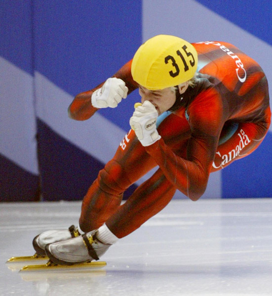 Canadian short track speed skater Marc Gagnon pumps his fist after winning the men's 500 metre Saturday Feb. 23, 2002 at the 2002 Winter Olympic Games in Salt Lake City. Canadian Gagnon went on to win gold for the 5,000 metre relay also. (CP Photo/COA/And