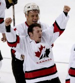 Canada's Theoren Fleury (front) and Jarome Iginla celebrate Canada's victory in men's hockey team defeating the U.S. 5 - 2 to take the gold medal at the Winter Olympics in West Valley City. Utah, Sun., Feb. 24, 2002 . (CP PHOTO/COA/Mike Ridewood)