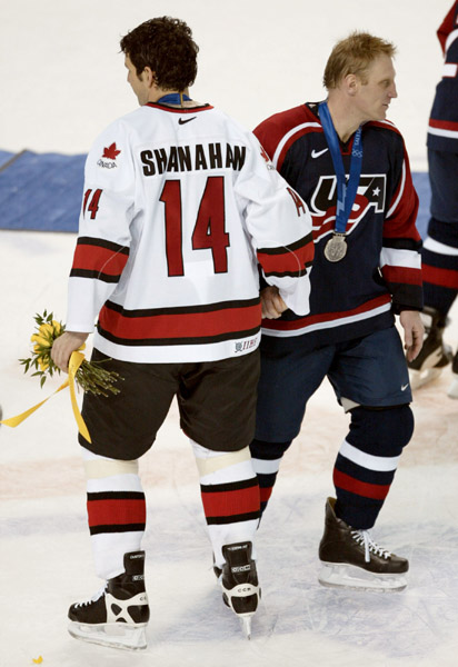 Canada's Brendan Shanahan shakes hands with Brett Hull of the U.S. after Canada's men's hockey team defeated the U.S. 5 - 2 to take the gold medal at the Winter Olympics in Salt Lake City, Utah, Sun., Feb. 24, 2002 . (CP PHOTO/COA/Mike Ridewood)