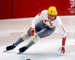 Canada's Annie Perreault (left) and Angela Cutrone (right) compete in the short track speed skating event at the 1992 Albertville Olympic winter Games. (CP PHOTO/COA/Ted Grant)