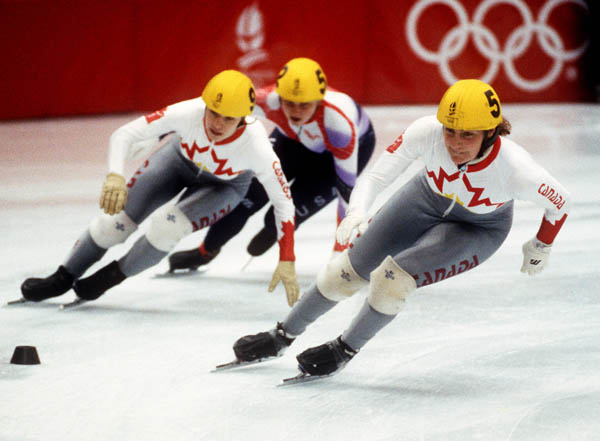 Canada's Annie Perreault (left) and Angela Cutrone (right) compete in the short track speed skating event at the 1992 Albertville Olympic winter Games. (CP PHOTO/COA/Ted Grant)