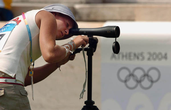Marie-Pier Beaudet of Canada looks through her scope towards her target during the first round of the women's archery individual eliminations competition at the 2004 Olympic Games at the Panathinaiko Stadium in Athens, Sunday Aug. 15, 2004. (CP PHOTO/COC-Andre Forget)