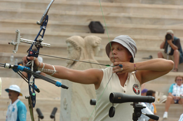 Marie-Pier Beaudet of Canada focuses on her target during the first round of the women's archery individual eliminations competition at the 2004 Olympic Games at the Panathinaiko Stadium in Athens, Sunday August 15, 2004. (CP PHOTO/COC-Andre Forget)