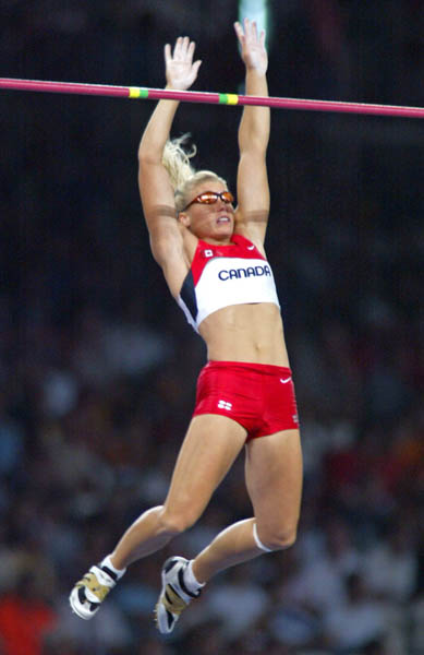 Canada's Dana Ellis of Kitchener, Ont., jumps to sixth in the women's pole vault final in track and field action at the Athens Olympics, Tuesday, August 24, 2004.(CP PHOTO)2004(COC-Mike Ridewood)