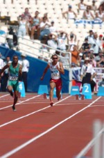 Canadian sprinter Nicolas Macrozonaris of Laval, Quebec, checks out his time after running during the 100m heat during the Athens 2004 Summer Olympic Games Saturday, August 21, 2004. Macrozonaris crossed the line with a time of 10.40 to move on. (CP PHOTO/COC-Andre Forget)