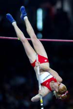 Canada's Dana Ellis of Kitchener, Ont., jumps to sixth in the women's pole vault final in track and field action at the Athens Olympics, Tuesday, August 24, 2004.(CP PHOTO)2004(COC-Mike Ridewood)